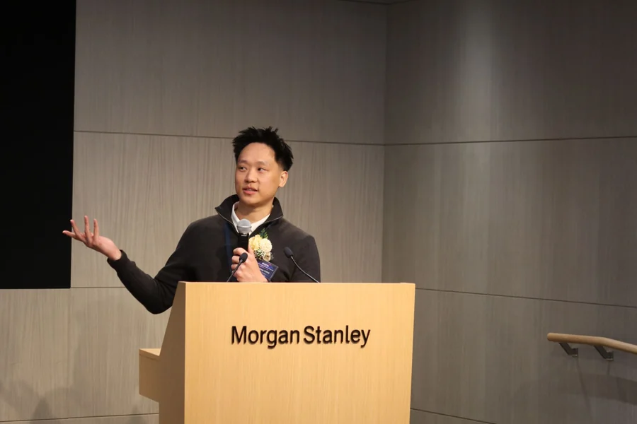 Jackson Wong speaking at the BAPaper2025 Grand Final Opening Ceremony, held at Morgan Stanley's Hong Kong office.